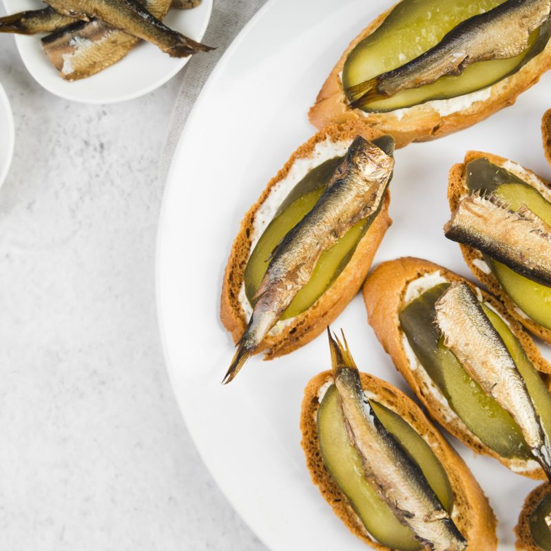 flat-lay-plate-with-fish-bruschettas