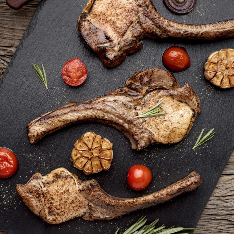 flat-lay-wooden-board-with-cooked-meat