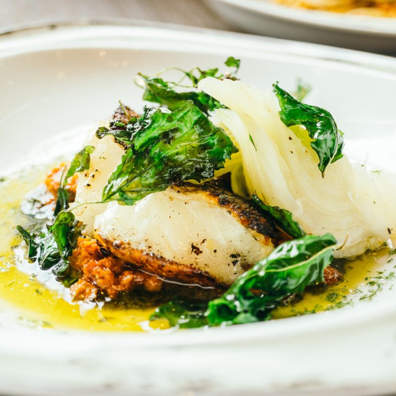 Seabass or Barramundi fish meat steak in white plate - Healthy food style , Color filter Processing